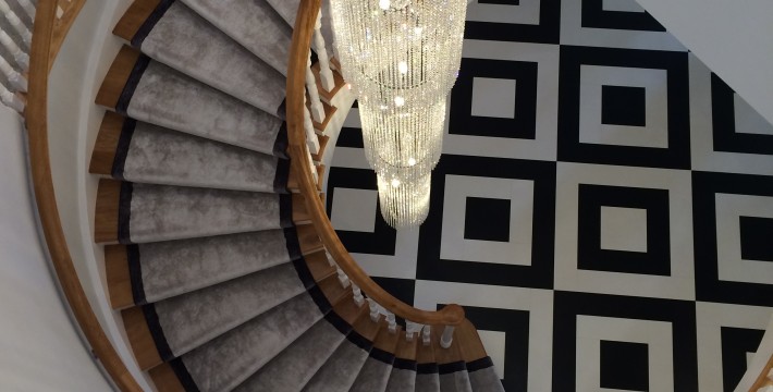 Luxury hanging chandelier over stairway
