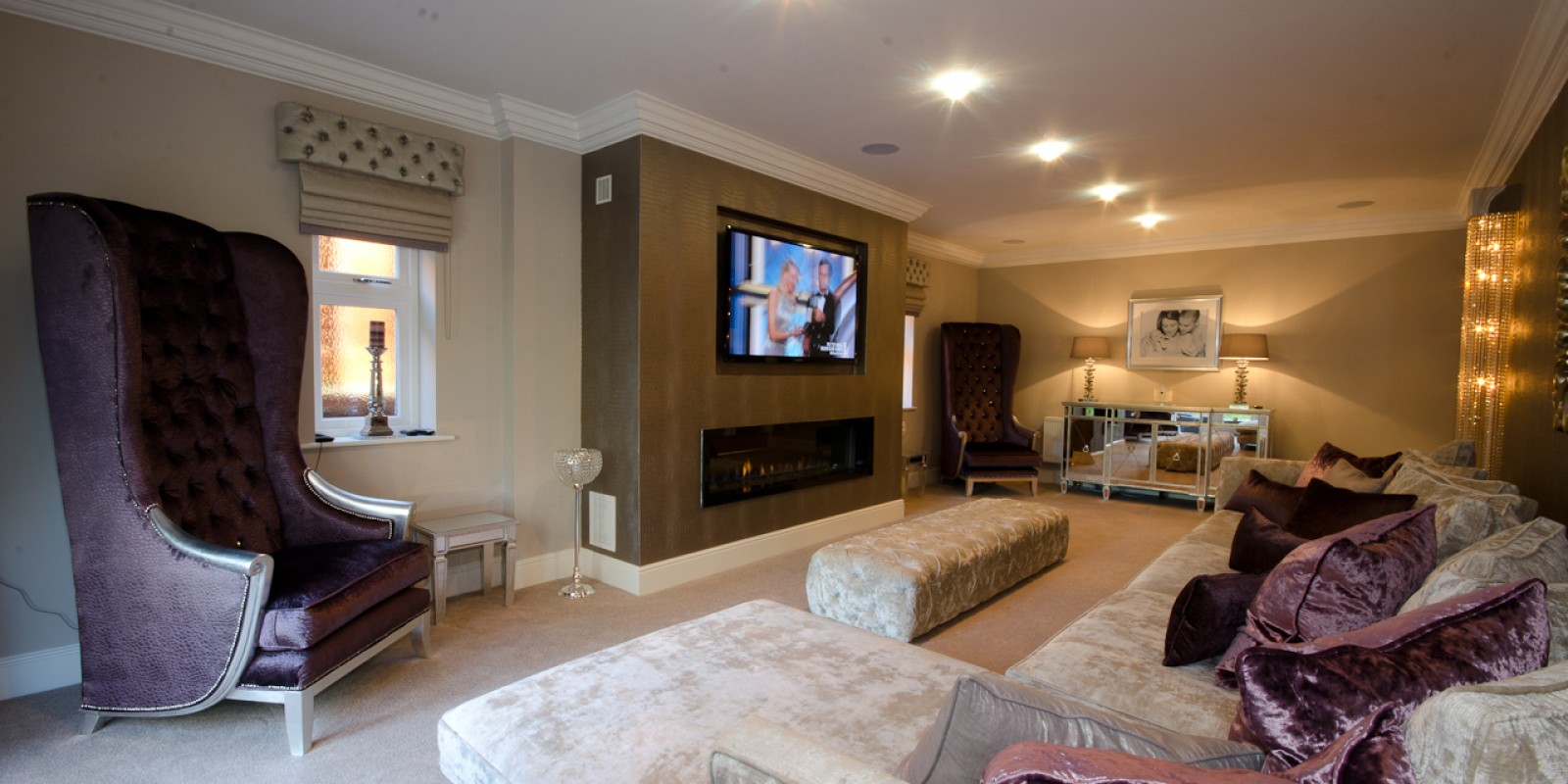 Luxury sitting room for a modern family home design with bespoke large sofa and large armchairs