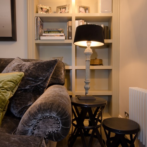 Velvet sofa design with bespoke joinery bookcase design