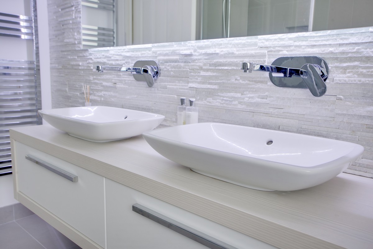 Double sink unit with soft tile tones for a modern bathroom